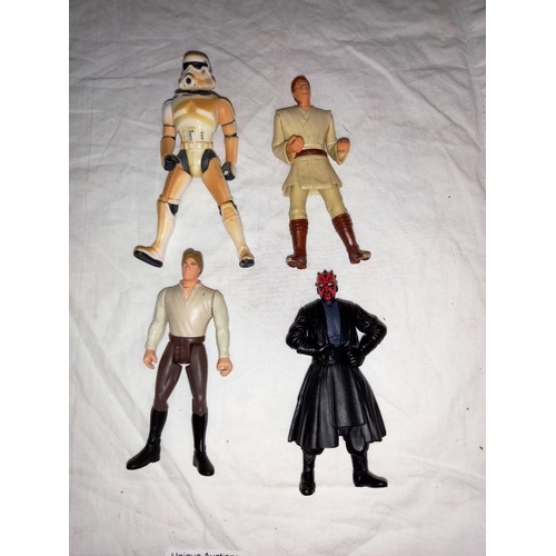 102 - A collection of Star Wars items including figures, cards, books & games including Monopoly & model k... 