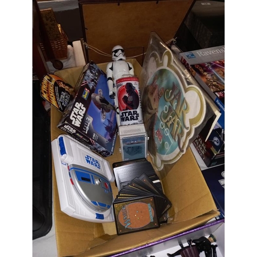 102 - A collection of Star Wars items including figures, cards, books & games including Monopoly & model k... 