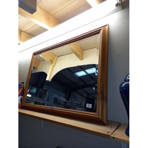 11 - A large pine framed bevel edge mirror