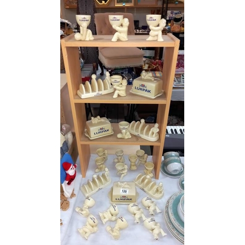 120 - A good selection of Lurpak advertising items including toast racks, egg cups & butter dishes