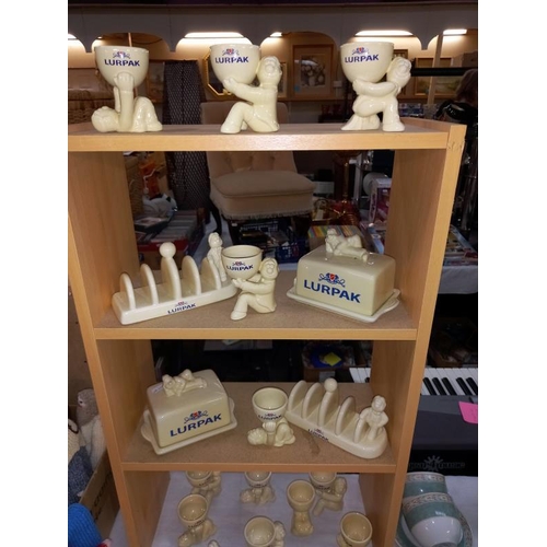 120 - A good selection of Lurpak advertising items including toast racks, egg cups & butter dishes