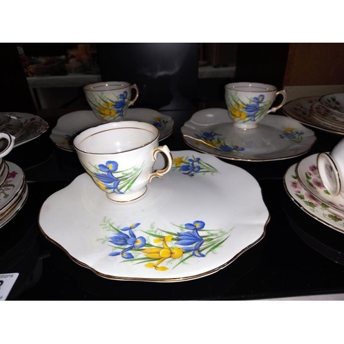 128 - A quantity of bone china part tea sets including Paragon etc.