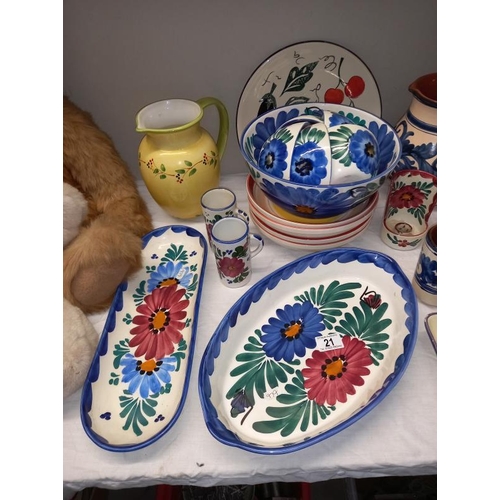 21 - A selection of floral pottery table ware