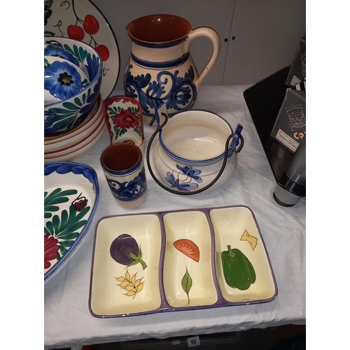 21 - A selection of floral pottery table ware