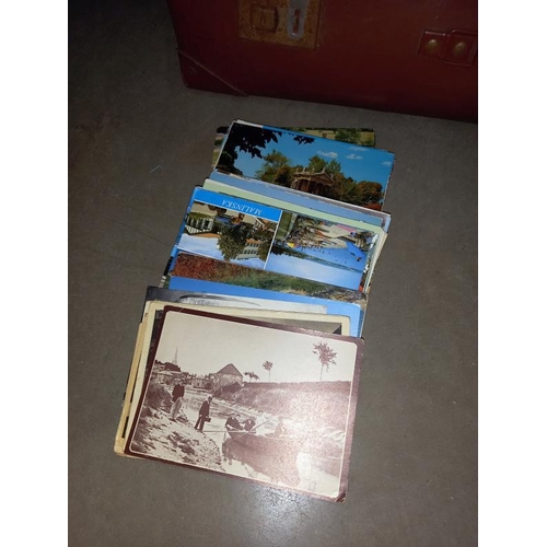 48 - A case full of postcards and guide books etc