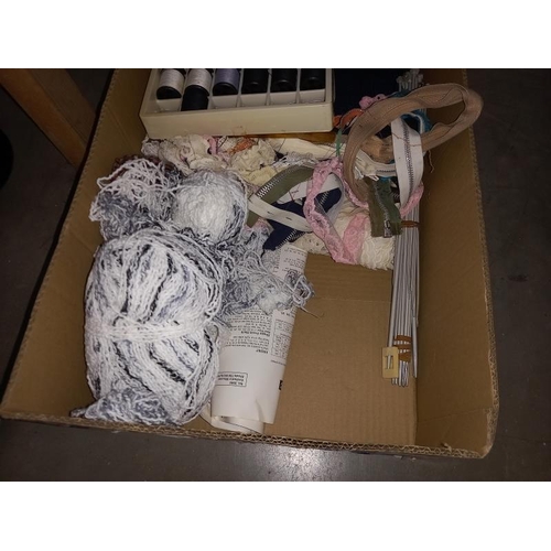 50 - A box of vintage sewing items including cotton reels, wicker basket, knitting needles etc