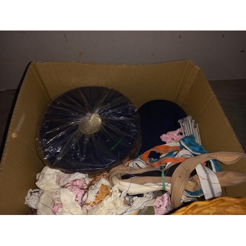 50 - A box of vintage sewing items including cotton reels, wicker basket, knitting needles etc