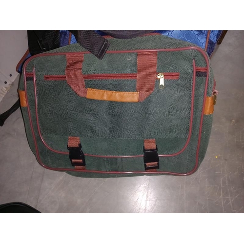 53 - 2  laptop bags, a bag and suit holder, plus a bum bag