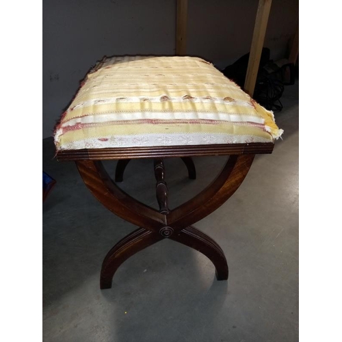 54 - An old mahogany piano stool,