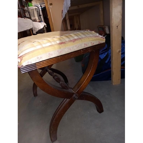 54 - An old mahogany piano stool,