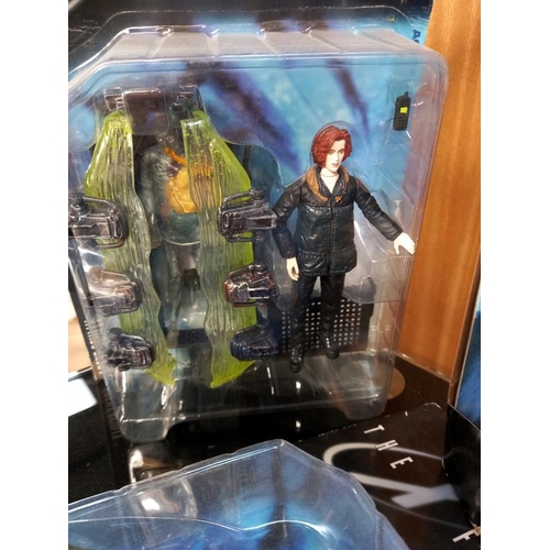 74 - A Barbie and Ken The X-Files gift set and 4 X files figures, all boxed