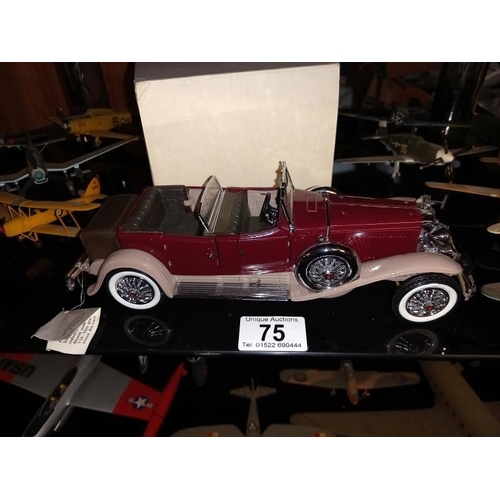 75 - A boxed Franklin Mint car and a collection of made and hand painted model aeroplanes