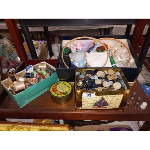 83 - A good lot of vintage sewing items including cotton reels, large tin of buttons etc