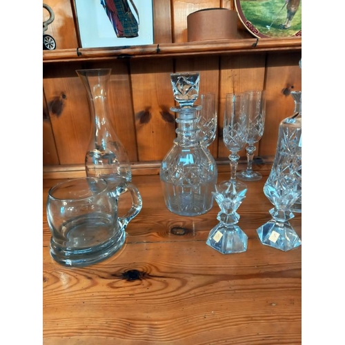 131 - 2 cut glass decanters, & a pair of Nachtmann German crystal candle holders etc