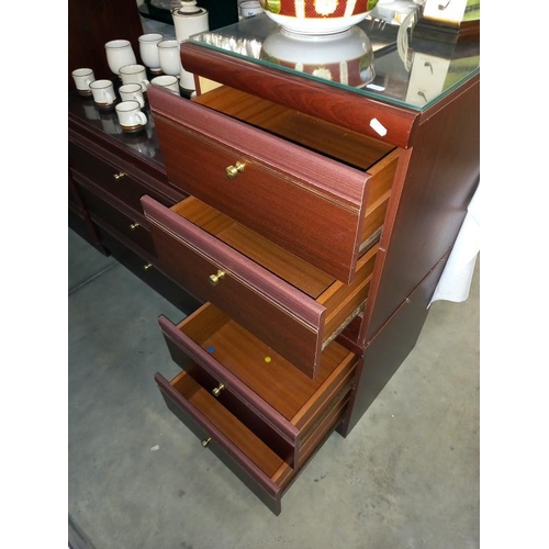 140 - Dark wood stained bedroom chests including a pair of bedsides & Gent's cupboard with 2 drawers