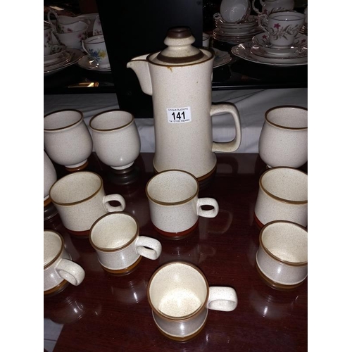 141 - A stoneware coffee pot & 6 stemmed cups (no handles) & a quantity of Denby cups (2 sizes)