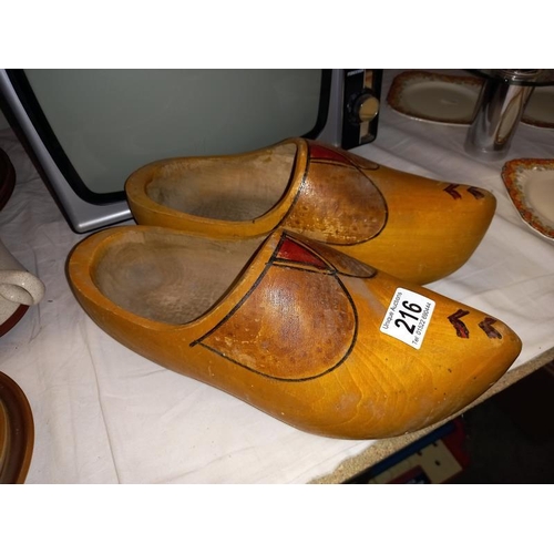 216 - A pair of vintage wooden clogs