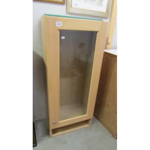 1455 - A light wood effect display cabinet. COLLECT ONLY.