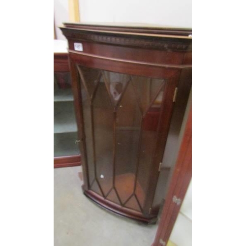 1457 - A dark wood stained mahogany astragal glazed corner cupboard. COLLECT ONLY.