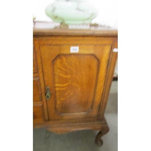 1462 - A good quality oak sideboard with two cupboards and three central drawers, COLLECT ONLY.