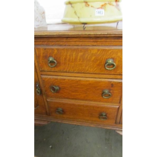 1462 - A good quality oak sideboard with two cupboards and three central drawers, COLLECT ONLY.