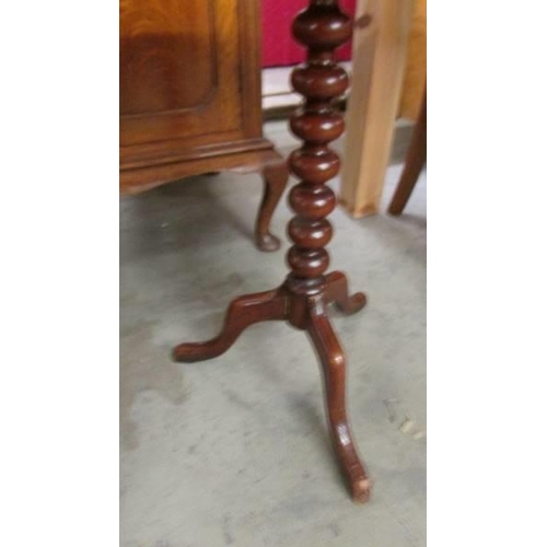 1464 - An oval oak occasional table on tripod base with bobbin turned column. COLLECT ONLY.