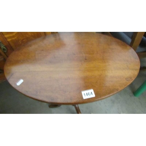 1464 - An oval oak occasional table on tripod base with bobbin turned column. COLLECT ONLY.