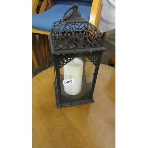 1466 - A metal candle lantern.