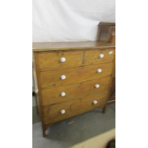 1468 - A pine two over three chest of drawers with ceramic knobs. COLLECT ONLY.