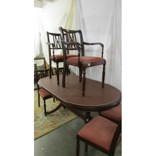 1471 - An oval mahogany dining table with six chairs. COLLECT ONLY.