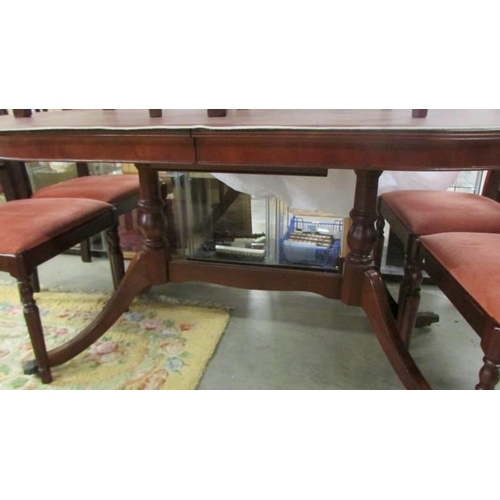 1471 - An oval mahogany dining table with six chairs. COLLECT ONLY.