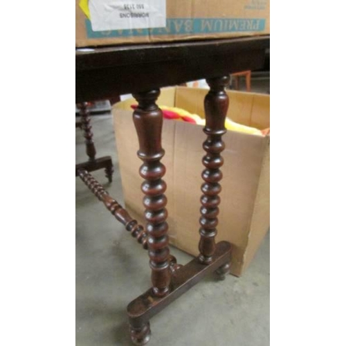 1480 - A mahogany side table with bobbin turned legs. COLLECT ONLY.