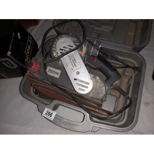 266 - A cased belt sander. (COLLECT ONLY)