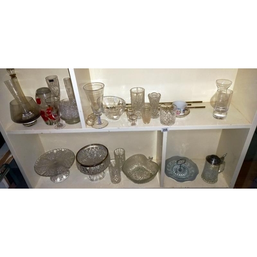 288 - A large quantity of miscellaneous vintage glass including bowls, cake stands & tankards etc. (4 shel... 