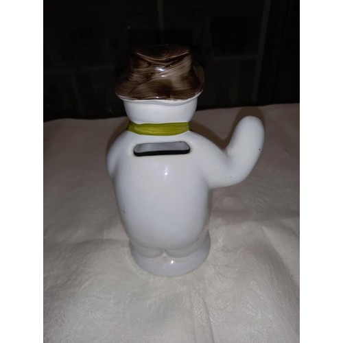 332 - An unmarked pottery snowman money box 18cm high