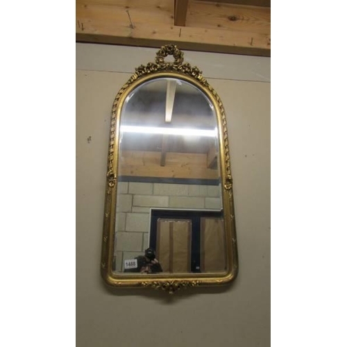 1488 - An arched top gilt framed bevel edged mirror. COLLECT ONLY.