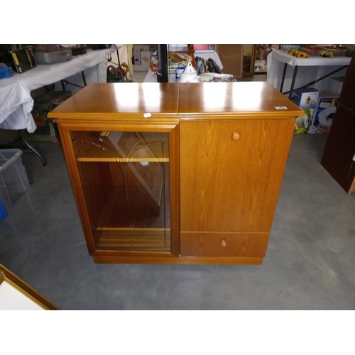 369 - A teak effect music centre cabinet with cutglass door and lift up lid 89cm x 49cm x height 81cm