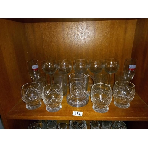 374 - Good lot of drinking glasses on 4 shelves