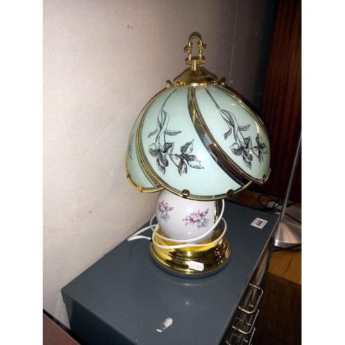 445 - A Tiffany style touch lamp with integral clock