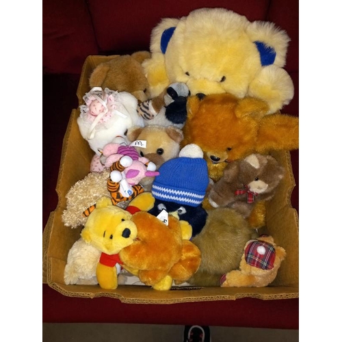 450 - A box of soft toys including Winnie The Pooh, teddies etc