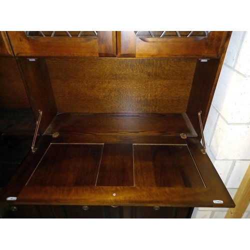 456 - A dark wood stained side board/wall unit