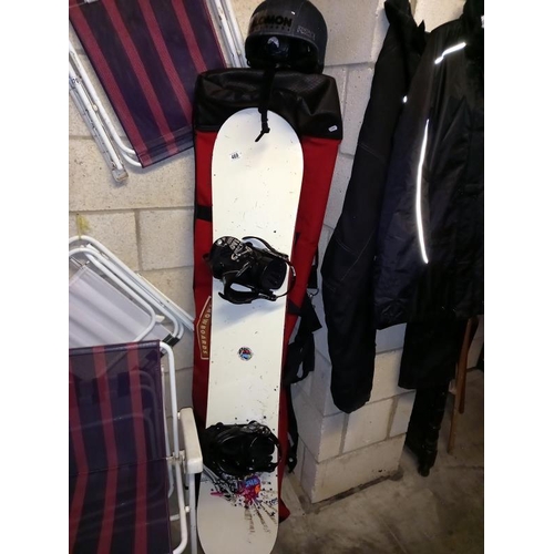 469 - A snowboard with bag and helmet