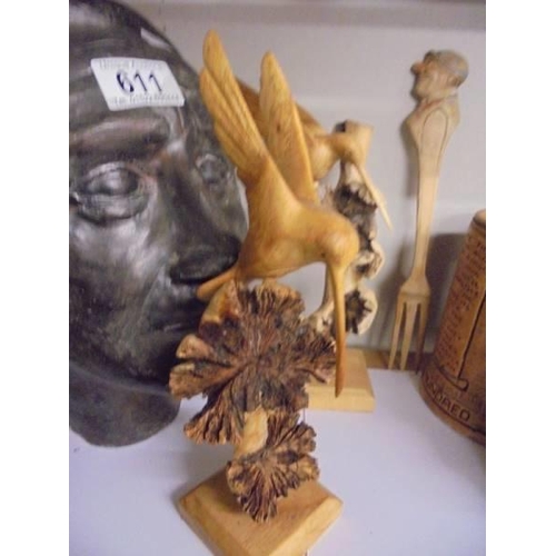 612 - Two carved wood birds, Two Scottish themed tankards and a wooden fork.