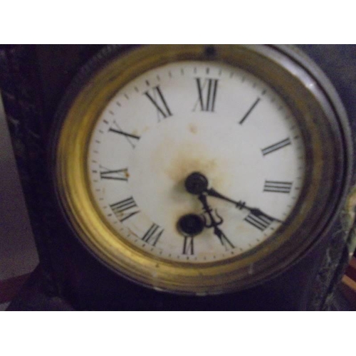 613 - A 19th century black slate Paladian style clock in working order. COLLECT ONLY.