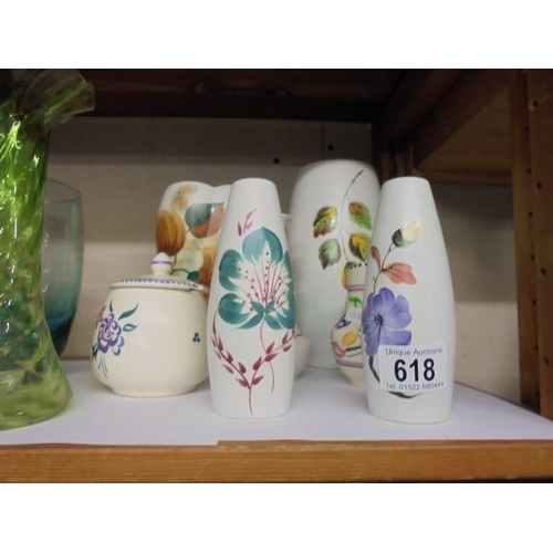 618 - Four vases, a jam pot, salt and pepper pots including Poole Pottery.