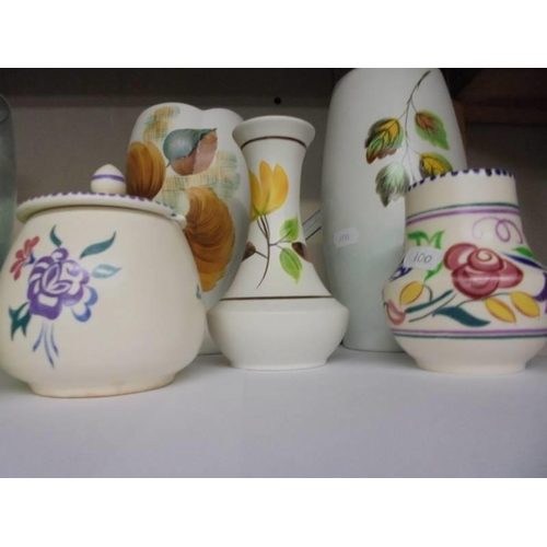 618 - Four vases, a jam pot, salt and pepper pots including Poole Pottery.