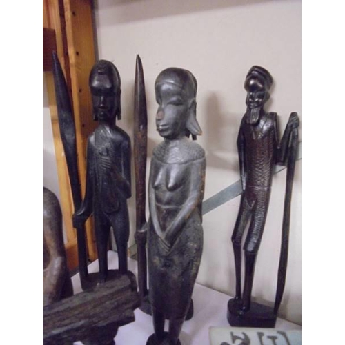 619 - Ten carved wood tribal figures.