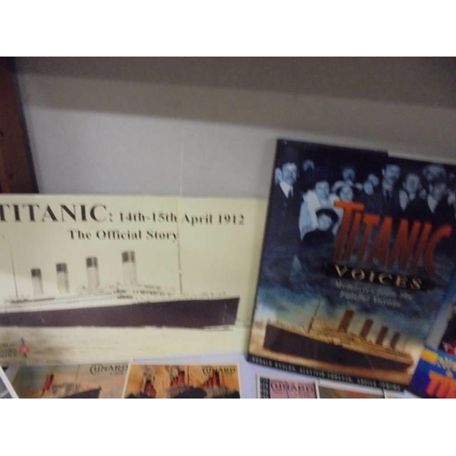 623 - A collection of Titanic related books and Cunard Line postcards.