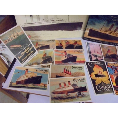 623 - A collection of Titanic related books and Cunard Line postcards.