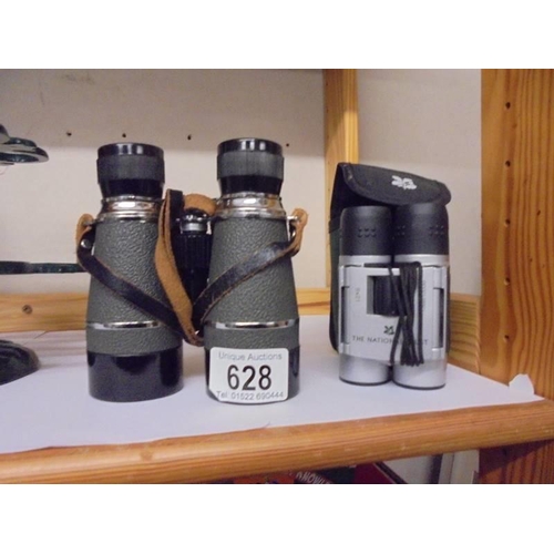 628 - A cased pair of National Trust binoculars and one other.